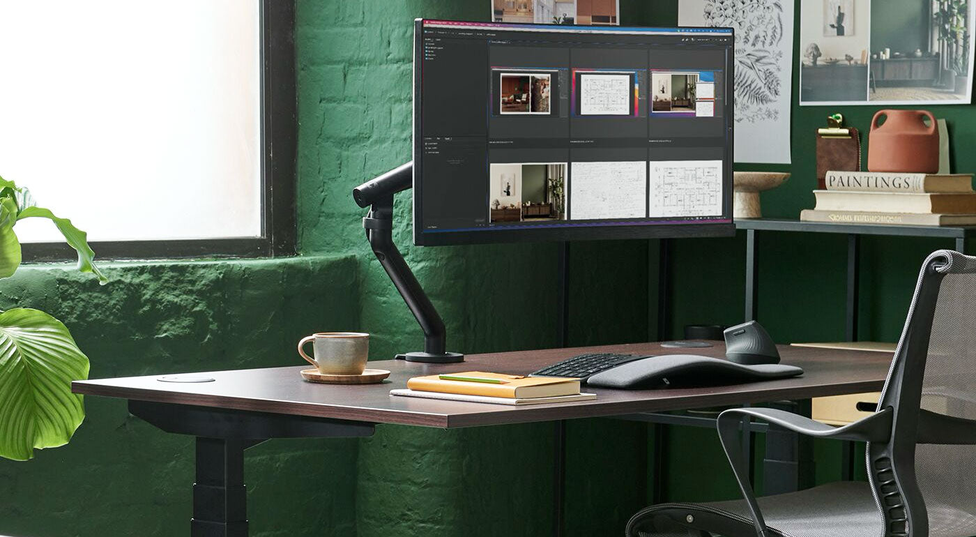 An ergonomic home office featuring a new Flo monitor arm, Jarvis sit-stand desk and Herman Miller Setu chair.