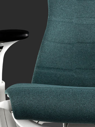 Close-up of a blue and white Embody gaming chair by Herman Miller, showing the fabric texture and finish.