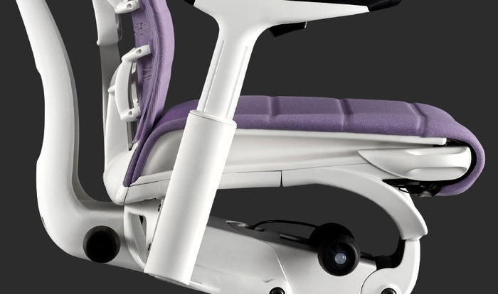 Close-up side view of a purple and white Embody gaming chair by Herman Miller.
