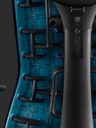Close-up rear view of a blue and black Embody gaming chair by Herman Miller.