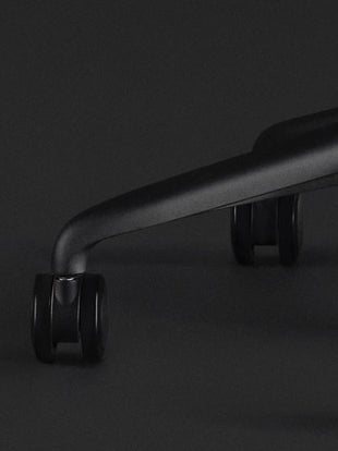 Close-up of a black Sayl gaming chair by Herman Miller, showing the black castors.