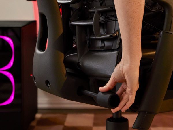 Close up of Dr Lindsey Migliore adjusting back on Embody gaming chair