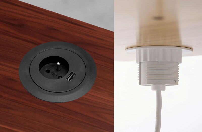 Top and bottom views of a grommet in a walnut laminate desk featuring a single power socket and USB connector.
