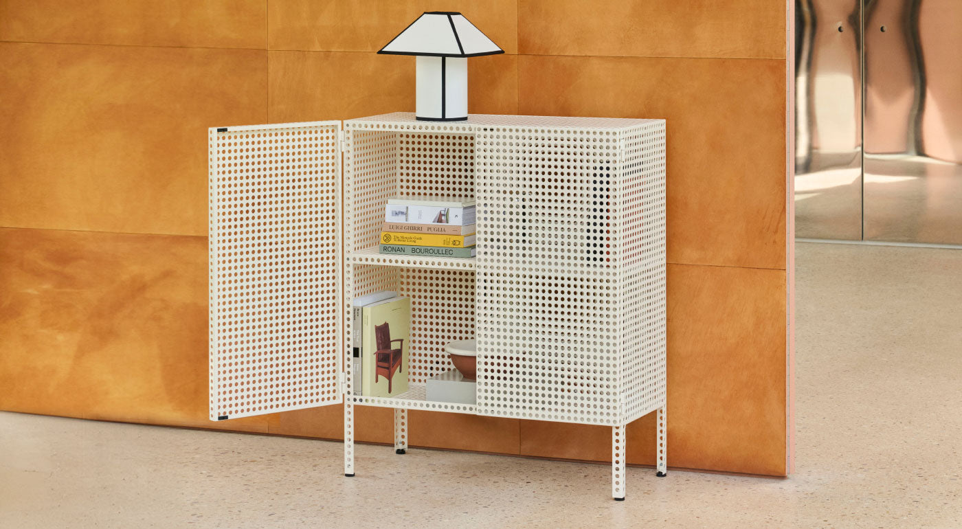 A selection of differently-sized HAY Perforated Cabinets in beight, blue, red and green.