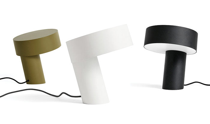 Three Slant lamps by HAY in green, white and black, showcasing the three different colour options.