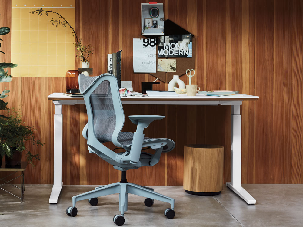 Home office scene with Cosm low back in glacier grey with Nevi sit-stand desk in white