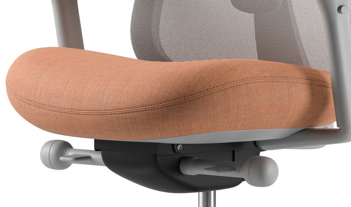 Close-up of a grey and pink Lino office chair by Herman Miller, showing the contoured seat.