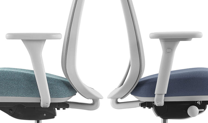 Side view of two Herman Miller Lino office chairs back to back. Both chairs are grey and blue, with the left chair showing the fixed armrest and the right chair showing the fully adjustable armrest.