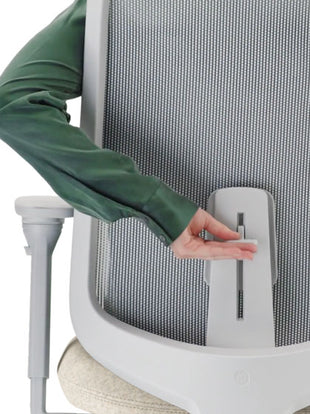Rear view of a grey Verus office chair by Herman Miller, showing the adjustable back support.