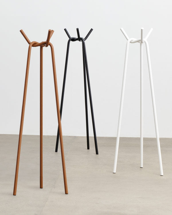 Three Knit coat racks by HAY, showing the three colours available - toffee, black and white.