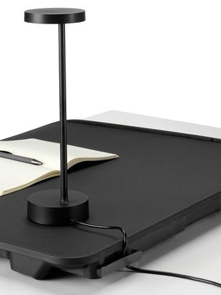 Close-up of a Monto sit stand by Herman Miller, showing the integrated cable management clips.