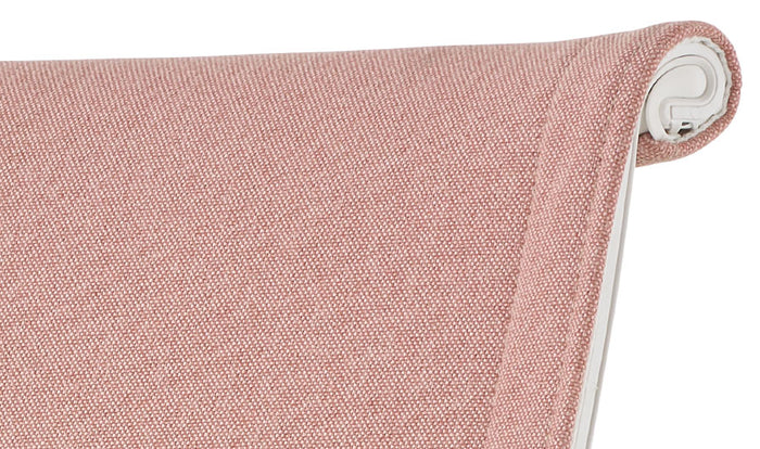 Close-up of a pink Setu office chair by Herman Miller, showing the texture of the Meld fabric upholstery.