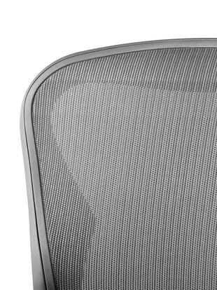Close-up of the back rest of a Aeron office chair by Herman Miller, showing the 8Z Pellicle material.