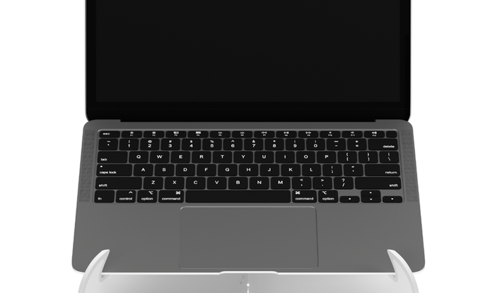Front view of a white Oripura laptop stand by Herman Miller holding a laptop.