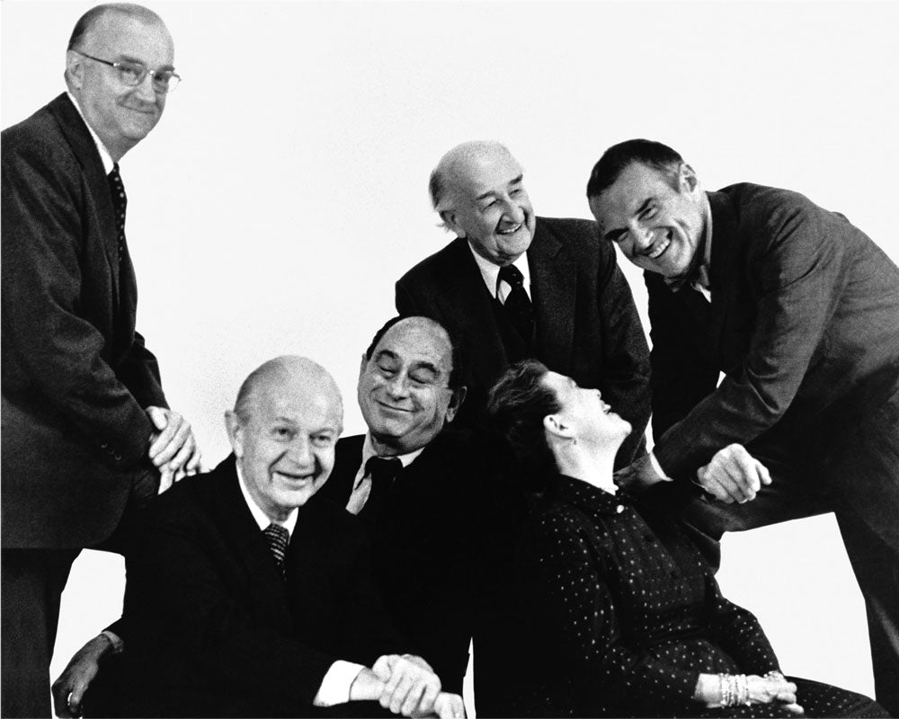 Black and white photograph of Herman Miller founder D.J. De Pree with director of design George Nelson  and the  designers they hired: Robert Propst, Alexander Girard, and Ray and Charles Eames.