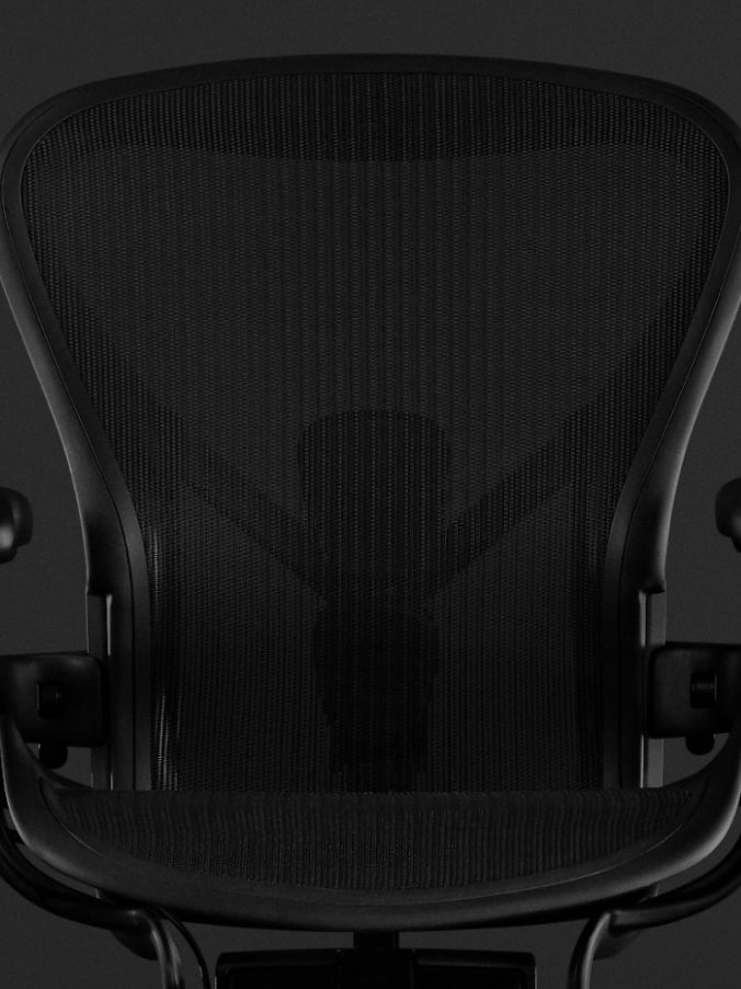 Font view of a black Aeron gaming chair by Herman Miller, showing the 8Z Pillicle material.