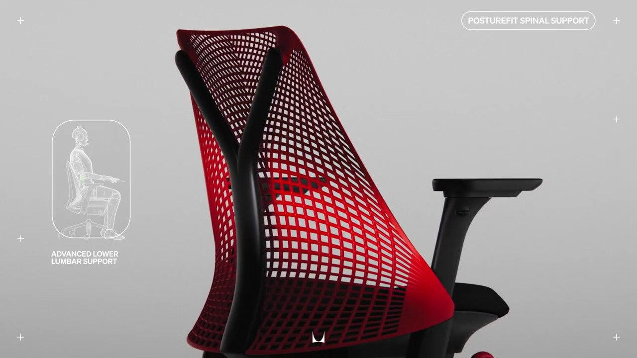 Rear view of back of Sayl gaming chair annotated with line drawing of  of person sat in chair with wording 'Advanced lower lumber support' and 'Posture Spinal Support'