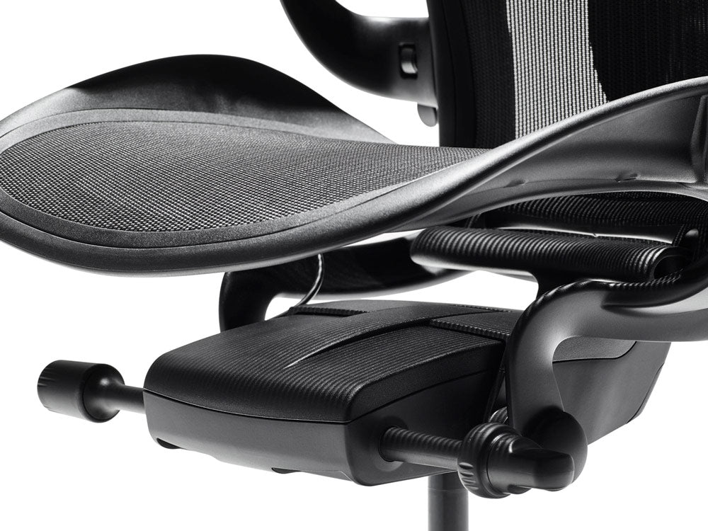 Close up of Aeron home office chair showing the adjustment mechanisms under the seat.