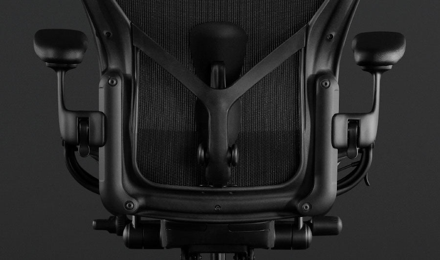 Back view of a black Aeron gaming chair by Herman Miller, showing the adjustable back support.