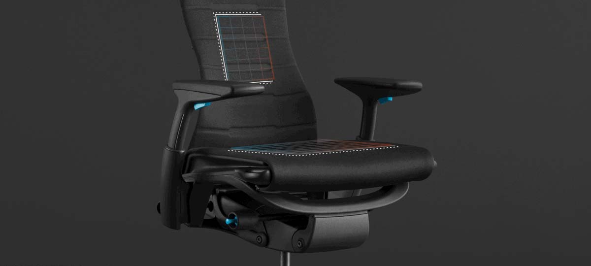 Font view of a black and blue Embody gaming chair by Herman Miller, overlaid with white graphics highlighting the seat and back.