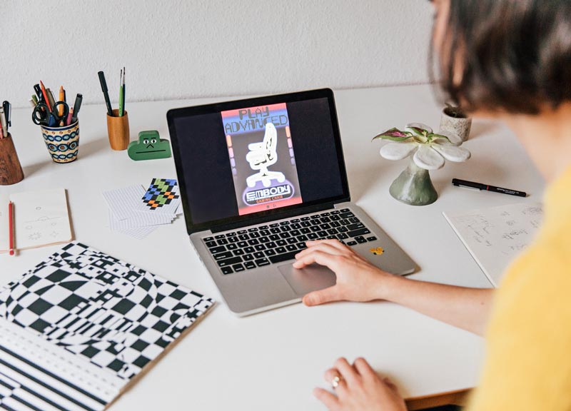 Close up of final iteration of the Embody gaming chair poster on Molly Rose Dyson's laptop