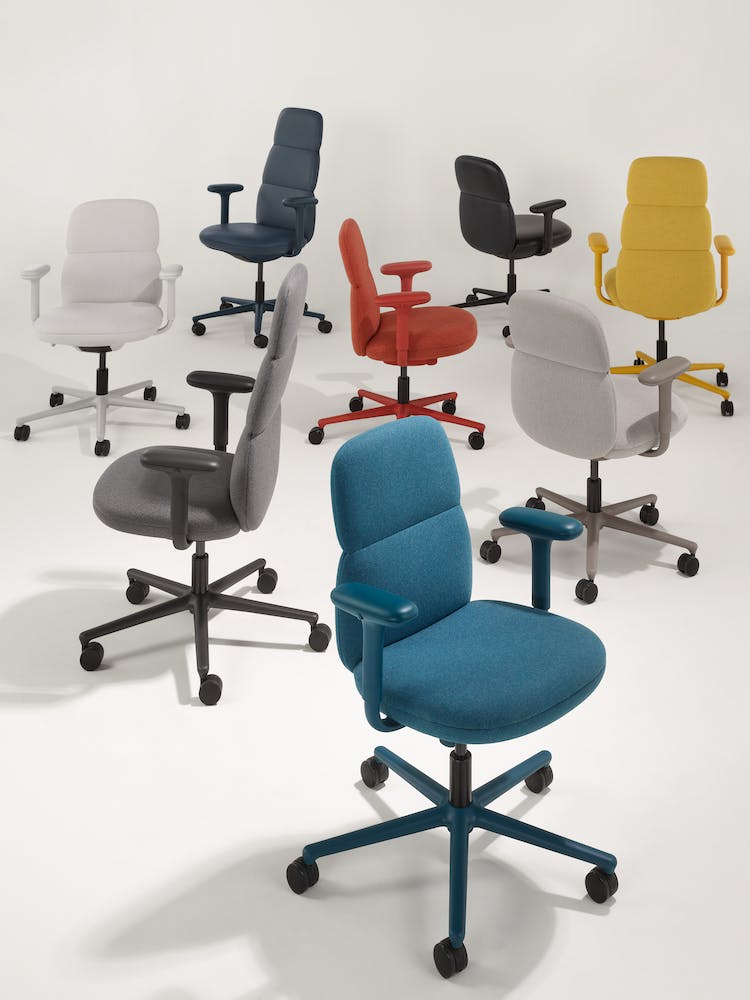 Eight Herman Miller Asari office chairs in grey, yellow, red and blue, showing the range of colours available.