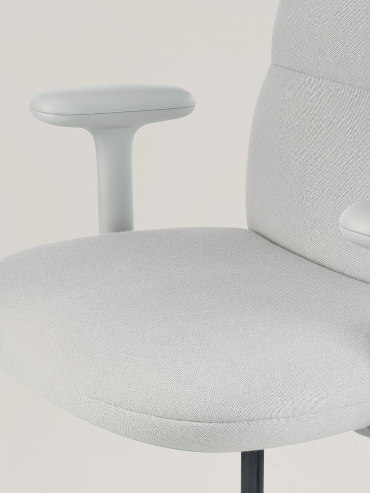 Close-up of a grey Asari office chair by Herman Miller, showing the contoured seat.