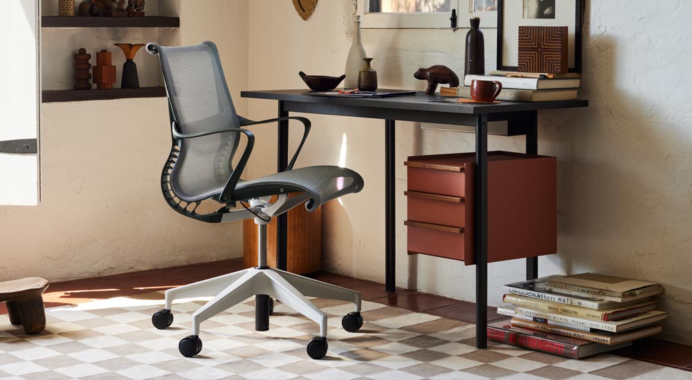 A Herman Miller Mode Desk and Setu chair.