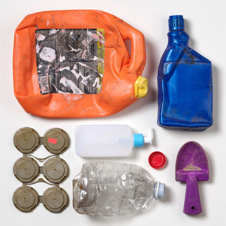 Photo on various plastic items recovered from the worlds oceans including bottles and lids