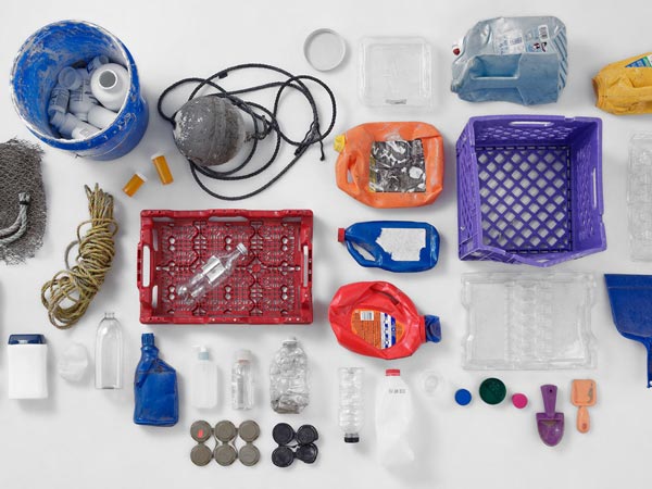 Photo on various plastic items recovered from the worlds oceans including bottles and lids