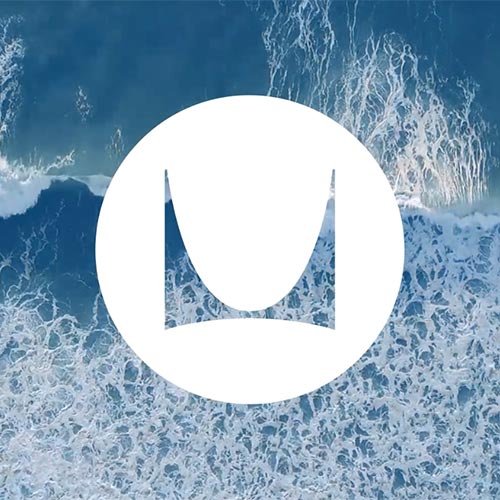 Image of ocean waves with white Herman Miller logo