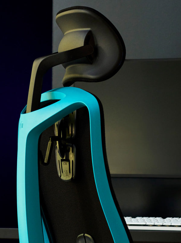 Close-up of a blue and black Vantum gaming chair by Herman Miller, showing the frame of the chair.