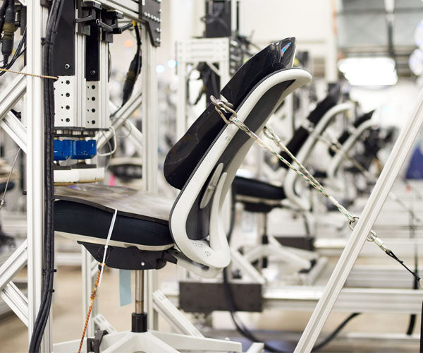 Photo of the million cycle test all Herman Miller chairs go through that replicates 12 years of continual use.