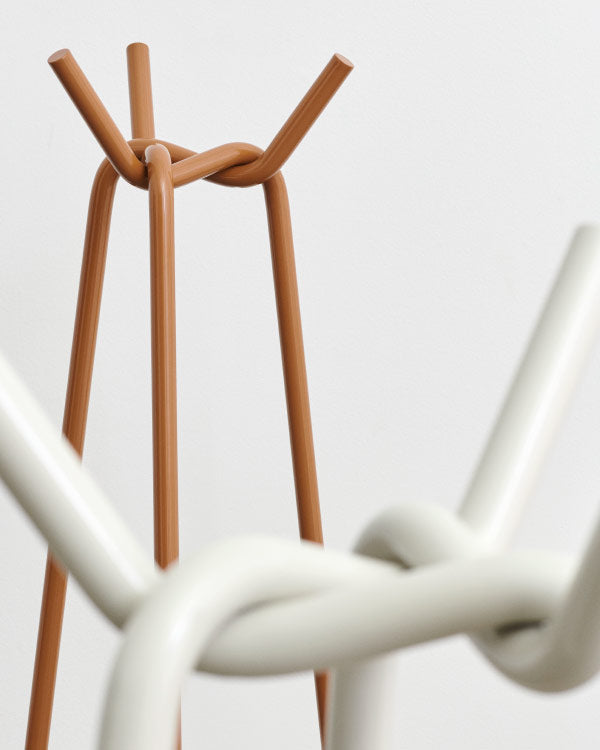 Close-up of a Knit coat rack by HAY, showing the metal pipes connected together at the top.