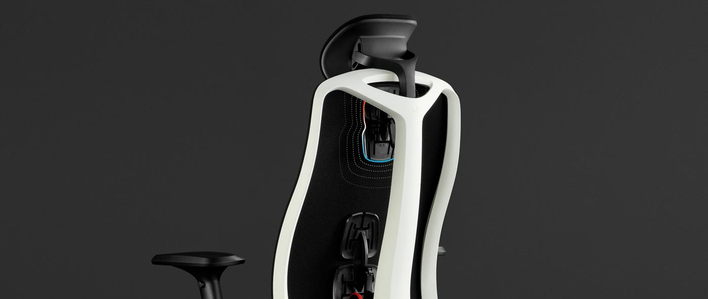 Rear view of a white and black Vantum gaming chair by Herman Miller, overlaid with white graphics highlighting the back support and headrest.