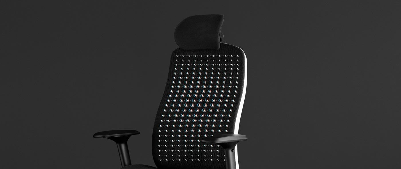 Front view of a white and black Vantum gaming chair by Herman Miller, overlaid with white graphics highlighting the suspension material.