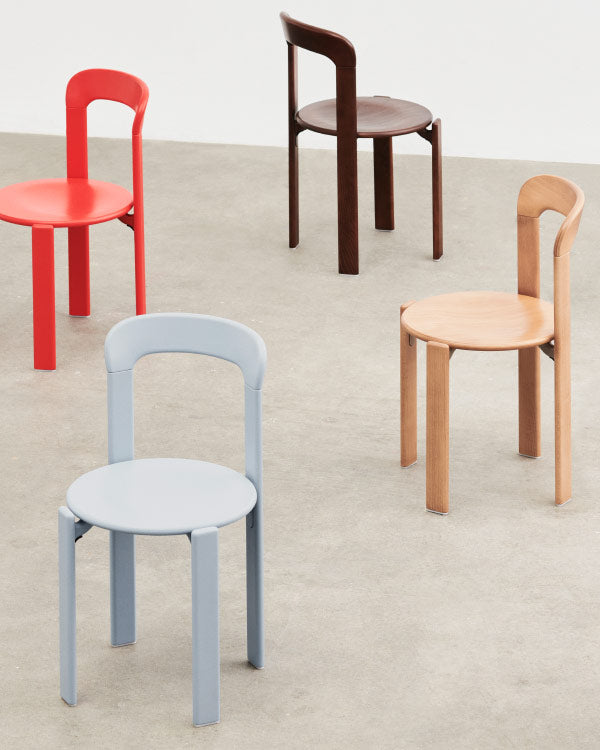 Group shot of four Rey chairs by HAY, showing the different colour options. Set in an indoor environment with concrete floors and white walls.