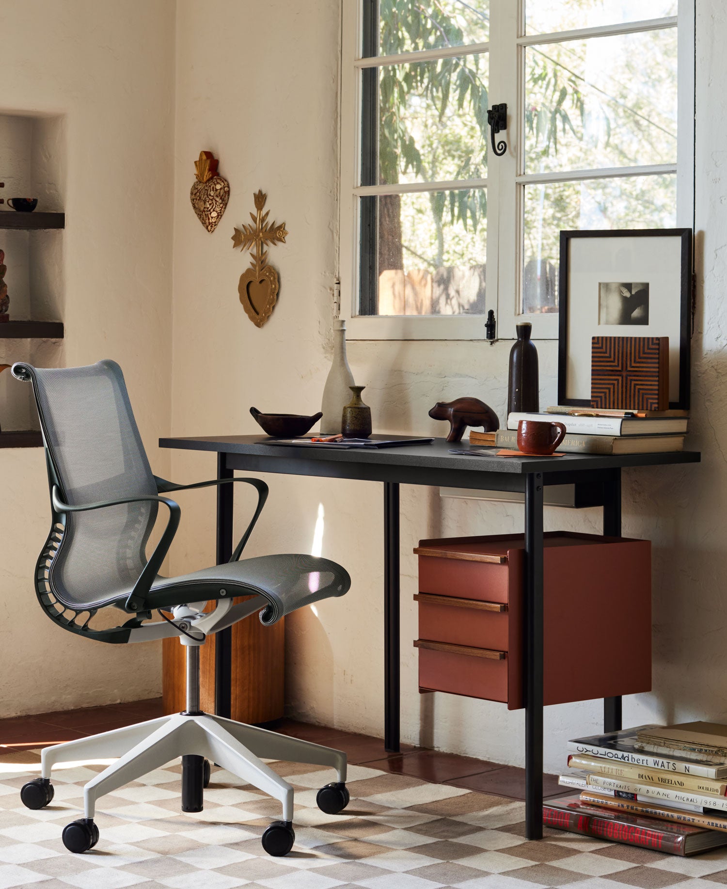 Home office setting with Setu office chair in dark grey with a compact Mode desk in black with draw storage.
