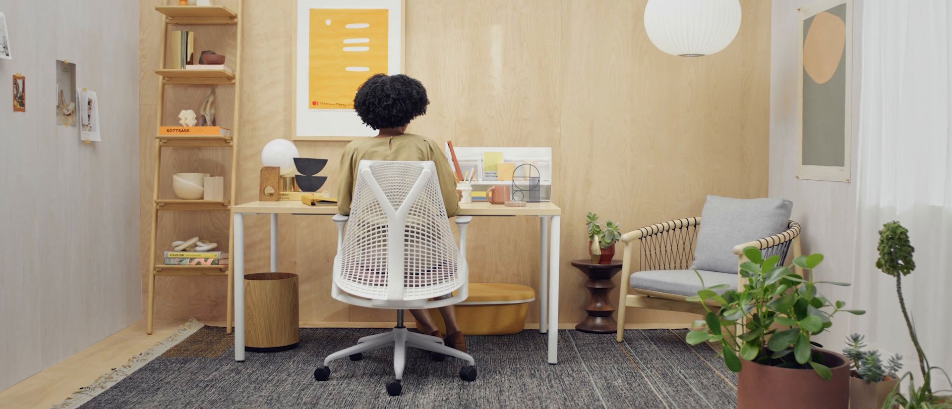 Video of home office settings changing to different people in different office scenes, with close up of the office chairs and desking being used