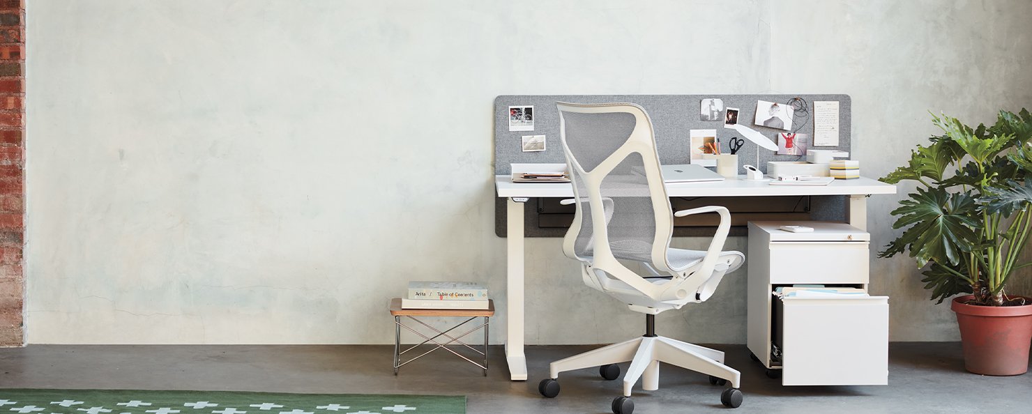 A white and grey Cosm chair in a home office environment