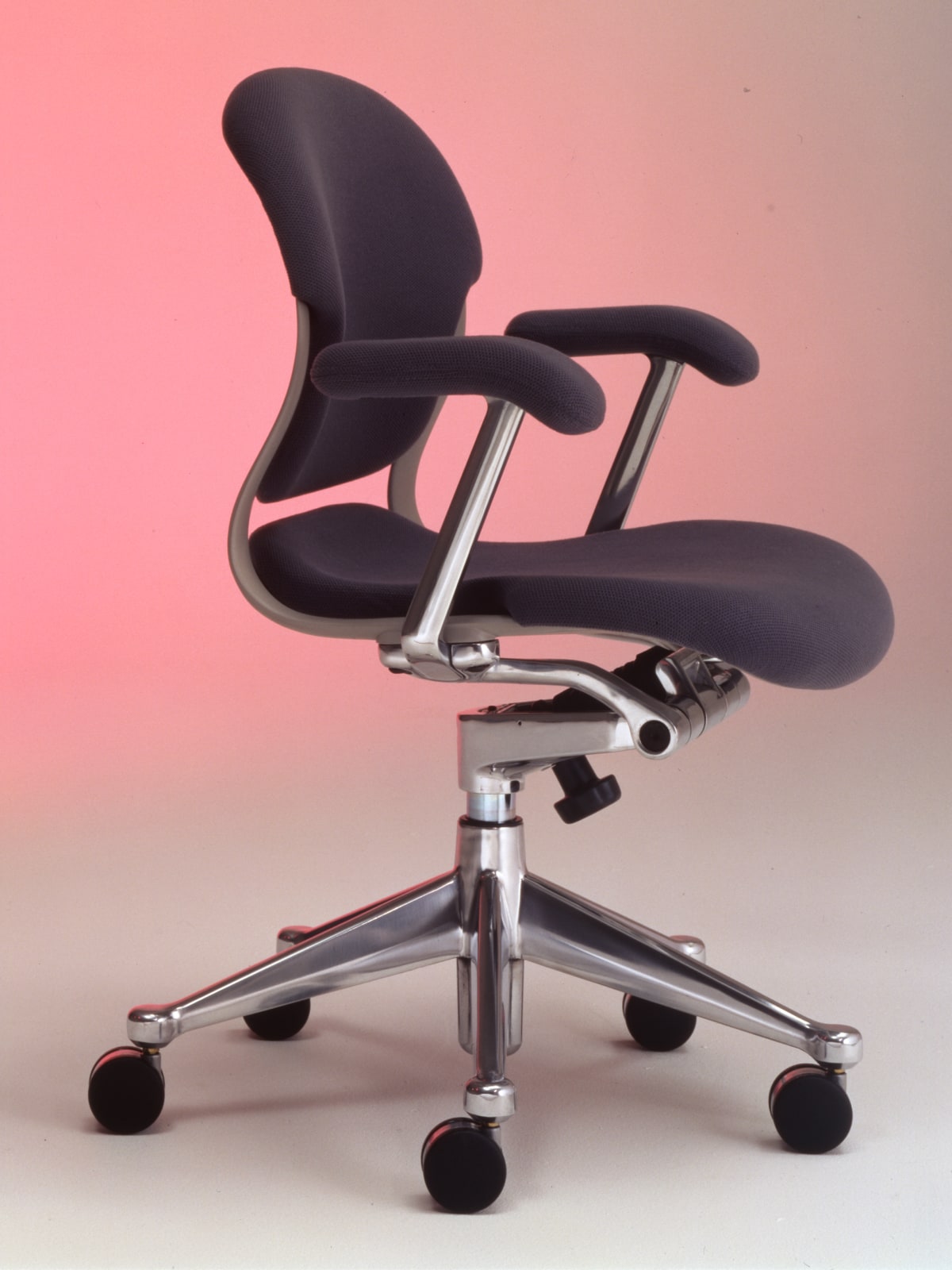 A Herman Miller Ergon chair with polished hardware and dark grey upholstery